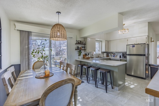 dining area with an inviting chandelier