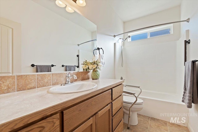 full bathroom featuring toilet, tile patterned floors, vanity, and bathtub / shower combination