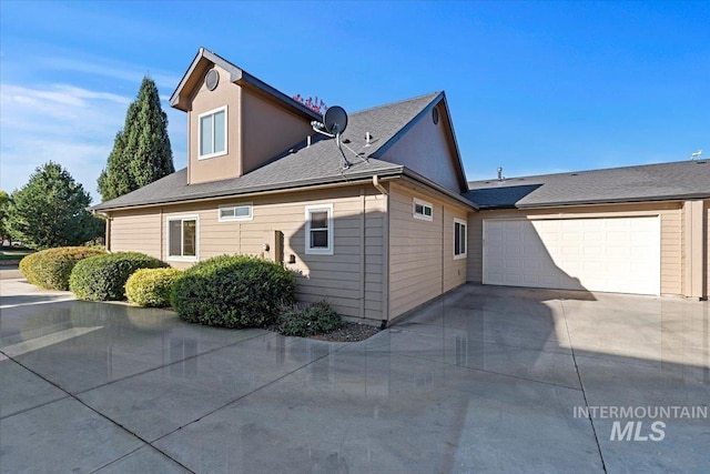 view of property exterior featuring a garage