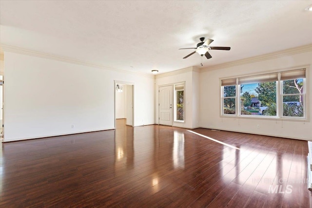 spare room featuring ornamental molding, ceiling fan, and dark hardwood / wood-style flooring