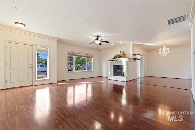 unfurnished living room with hardwood / wood-style flooring, crown molding, and ceiling fan with notable chandelier