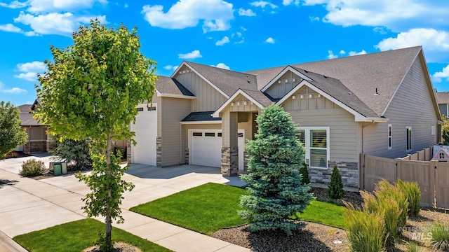 2843 E Murchison St, Meridian, ID 83642 - craftsman-style home with board and batten siding, concrete driveway, a shingled roof, a garage, and stone siding