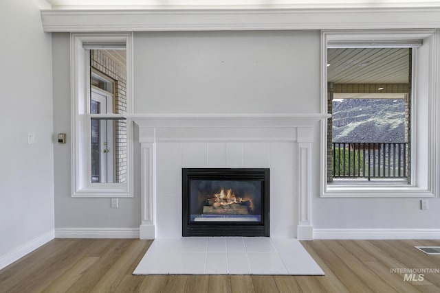 816 River View Dr, Twin Falls, ID 83301 - details with visible vents, baseboards, wood finished floors, and a fireplace