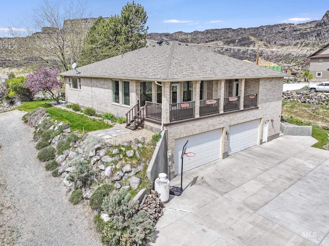 816 River View Dr, Twin Falls, ID 83301 - ranch-style home featuring concrete driveway, an attached garage, brick siding, and a shingled roof