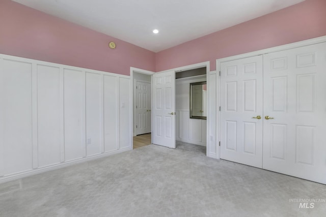 816 River View Dr, Twin Falls, ID 83301 - unfurnished bedroom featuring carpet floors, multiple closets, and a decorative wall