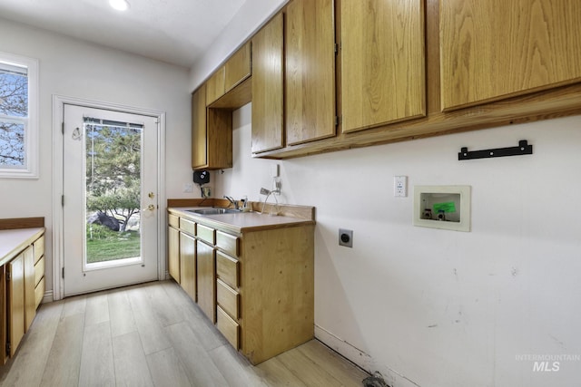816 River View Dr, Twin Falls, ID 83301 - laundry room featuring cabinet space, a healthy amount of sunlight, hookup for a washing machine, and hookup for an electric dryer