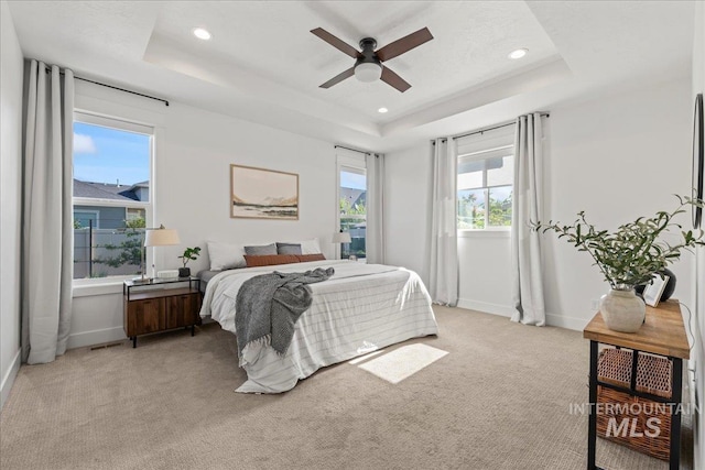 492 Applecreek St, Middleton, ID 83644 - bedroom with recessed lighting, a raised ceiling, light carpet, and a ceiling fan