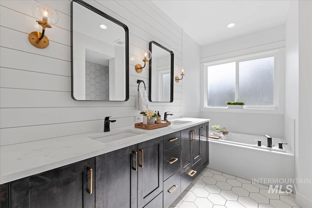 492 Applecreek St, Middleton, ID 83644 - bathroom featuring double vanity, a bath, recessed lighting, and tile patterned flooring