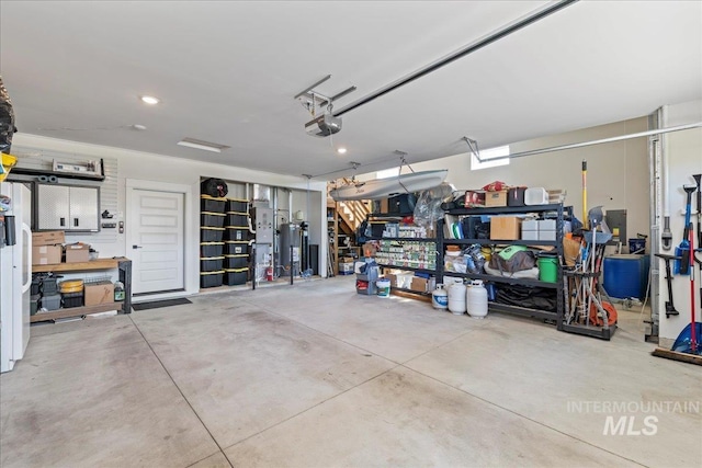 492 Applecreek St, Middleton, ID 83644 - garage featuring a garage door opener and water heater