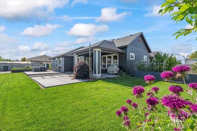 492 Applecreek St, Middleton, ID 83644 - rear view of property with a patio, board and batten siding, and roof with shingles