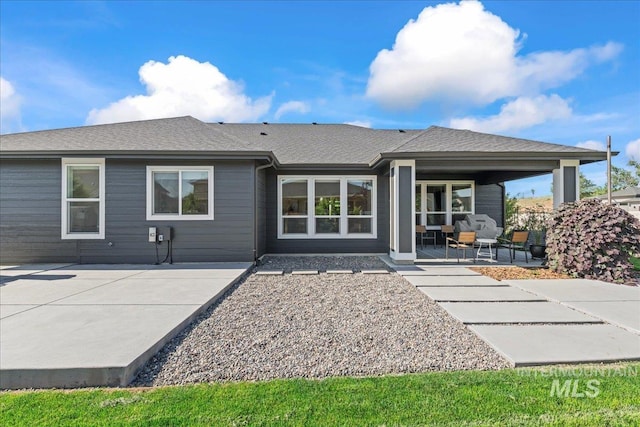 492 Applecreek St, Middleton, ID 83644 - rear view of house with a porch and a shingled roof