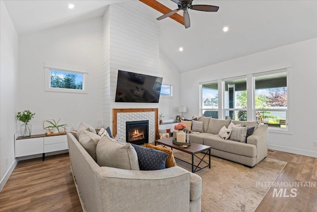 492 Applecreek St, Middleton, ID 83644 - living room featuring high vaulted ceiling, a tiled fireplace, wood finished floors, ceiling fan, and recessed lighting
