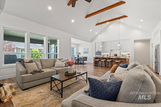 492 Applecreek St, Middleton, ID 83644 - living area with high vaulted ceiling, wood finished floors, a ceiling fan, beam ceiling, and recessed lighting