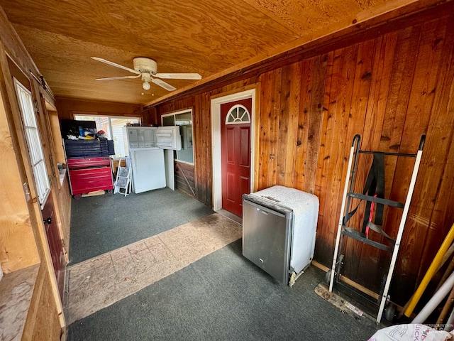 interior space with ceiling fan