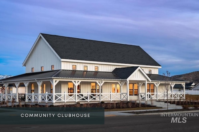 9351 W Sooty Grouse Ct, Boise, ID 83714 - view of front of home with board and batten siding, covered porch, a standing seam roof, and metal roof