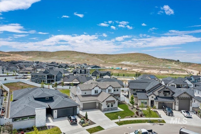 9351 W Sooty Grouse Ct, Boise, ID 83714 - aerial perspective of suburban area with a mountain backdrop