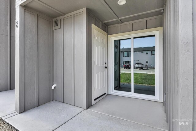 property entrance with board and batten siding