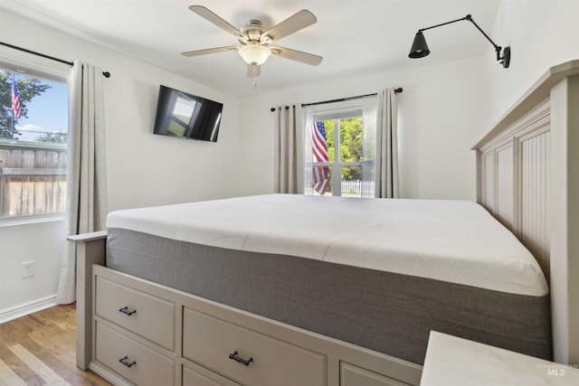 608 S Eagleson Rd, Boise, ID 83705 - bedroom with light wood-type flooring, baseboards, and ceiling fan