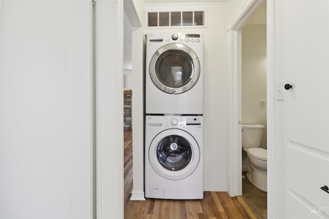 608 S Eagleson Rd, Boise, ID 83705 - laundry area featuring stacked washer / drying machine and wood finished floors