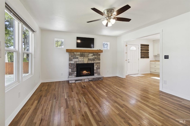 608 S Eagleson Rd, Boise, ID 83705 - unfurnished living room featuring hardwood / wood-style flooring, ceiling fan, a fireplace, and baseboards