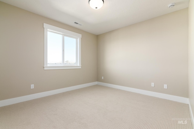 view of carpeted spare room