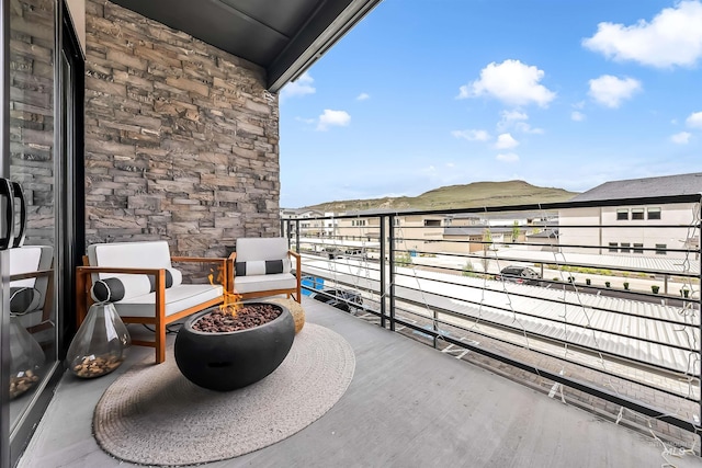 3850 E Haystack St Unit 205, Boise, ID 83716 - balcony with an outdoor fire pit and a mountain view