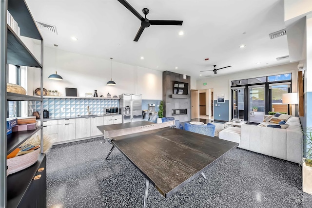3850 E Haystack St Unit 205, Boise, ID 83716 - kitchen with a ceiling fan, modern cabinets, appliances with stainless steel finishes, white cabinets, and hanging light fixtures