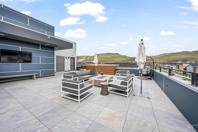 3850 E Haystack St Unit 205, Boise, ID 83716 - view of patio / terrace with an outdoor living space with a fire pit and a mountain view