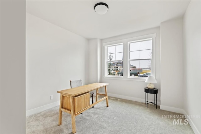 office space featuring baseboards and carpet floors