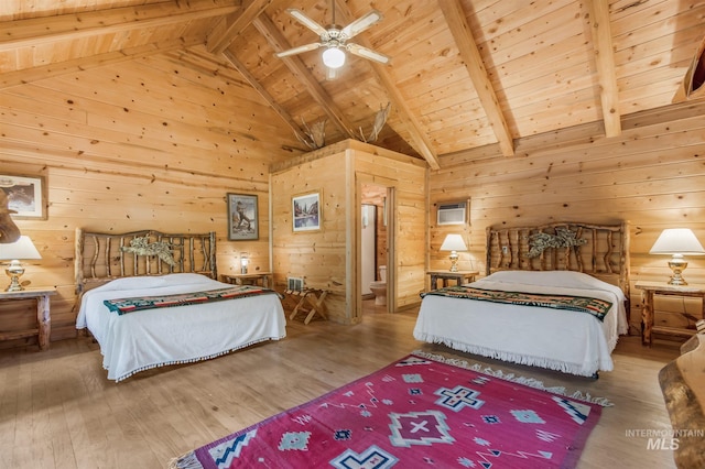 bedroom with light wood-type flooring, beamed ceiling, and wood ceiling