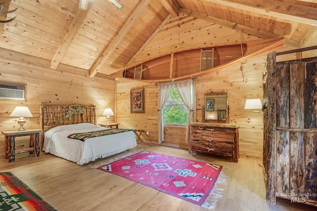 bedroom with wooden walls, light wood-type flooring, wooden ceiling, and vaulted ceiling with beams