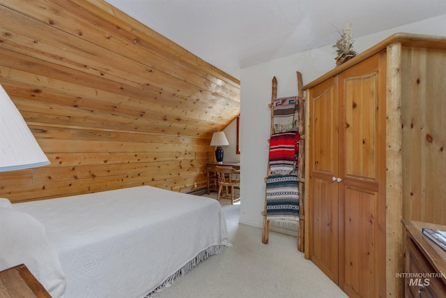 carpeted bedroom with wooden walls