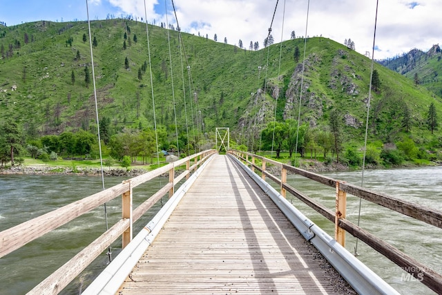 dock area featuring a water and mountain view