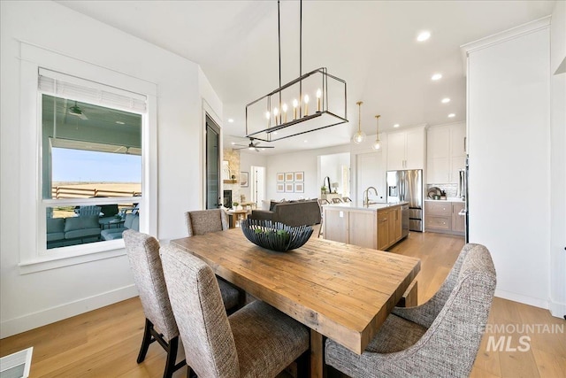 dining room with visible vents, baseboards, light wood-type flooring, and recessed lighting