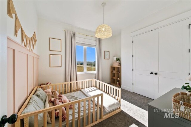carpeted bedroom featuring a closet
