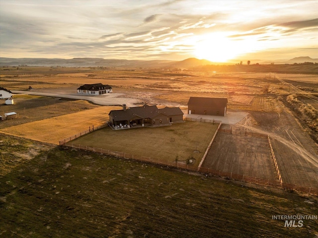 birds eye view of property featuring a rural view and a mountain view