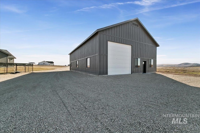 view of outdoor structure featuring an outbuilding and driveway