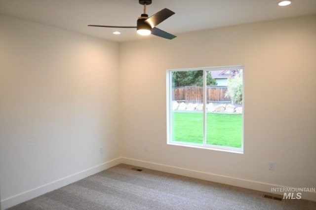 carpeted empty room with ceiling fan