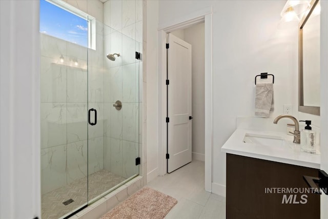 14739 N Power Way, Boise, ID 83714 - full bath featuring a marble finish shower, vanity, tile patterned flooring, and baseboards