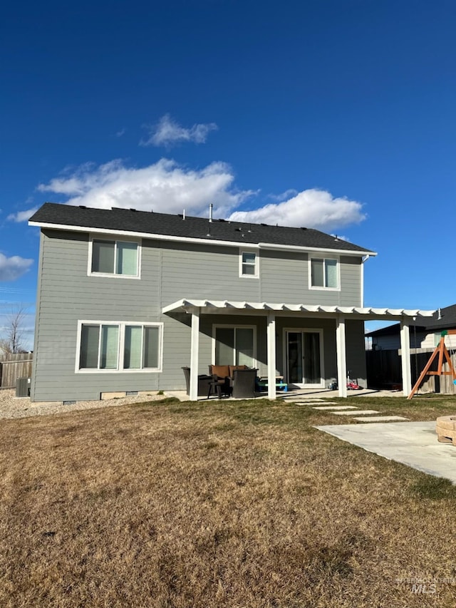 back of property featuring a patio, a playground, and a yard