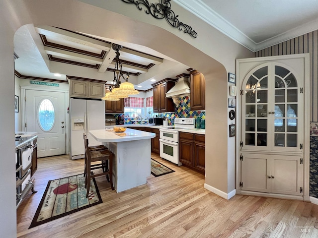 710 Locust St, Twin Falls, ID 83301 - kitchen featuring white appliances, plenty of natural light, light countertops, crown molding, and light wood-type flooring