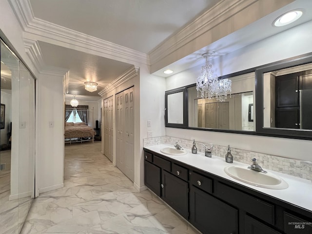 710 Locust St, Twin Falls, ID 83301 - bathroom with a chandelier, ensuite bathroom, double vanity, marble look tiles, and crown molding