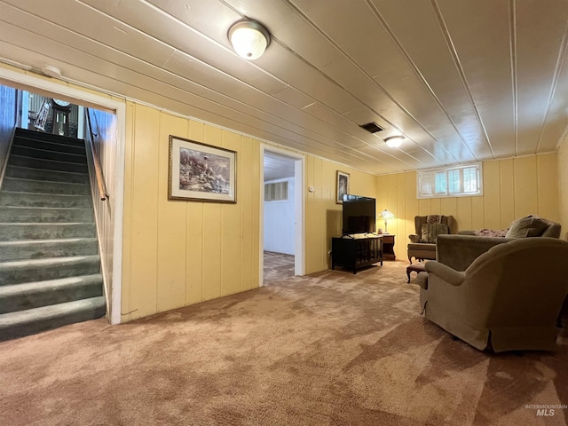 710 Locust St, Twin Falls, ID 83301 - carpeted living area with stairway and wood walls