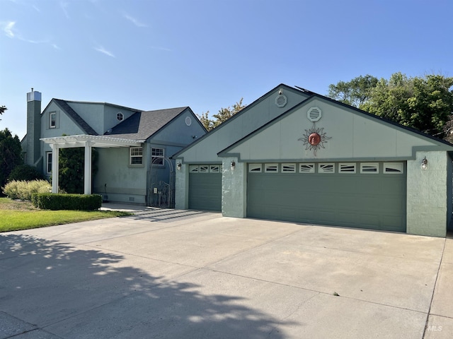 710 Locust St, Twin Falls, ID 83301 - ranch-style home featuring concrete driveway, a garage, stucco siding, and a pergola