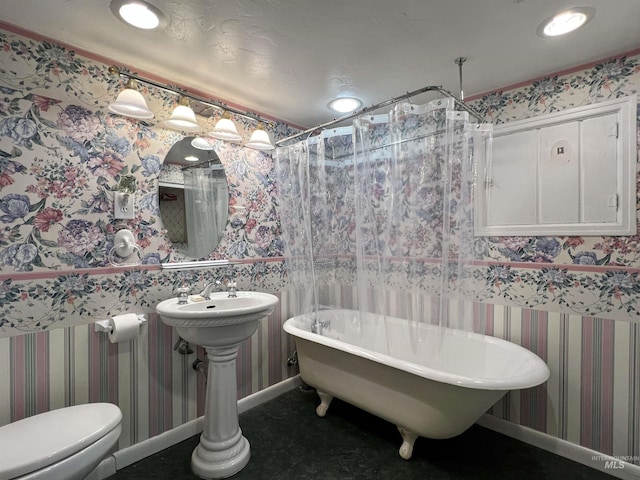 710 Locust St, Twin Falls, ID 83301 - bathroom with a freestanding tub, wallpapered walls, recessed lighting, and a shower with shower curtain