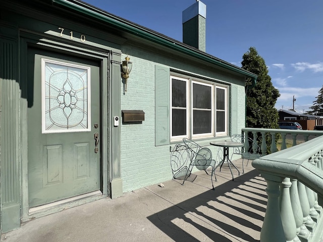 710 Locust St, Twin Falls, ID 83301 - entrance to property with a chimney and brick siding