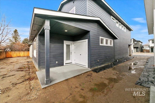 back of property with a patio area