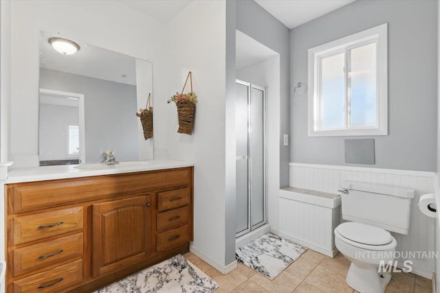 4320 N Locust Grv, Meridian, ID 83642 - bathroom featuring toilet, a shower stall, tile patterned flooring, and vanity