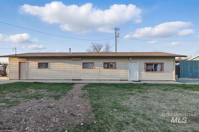 4320 N Locust Grv, Meridian, ID 83642 - rear view of house with fence and a yard