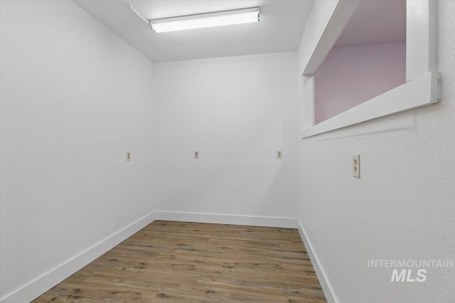 4320 N Locust Grv, Meridian, ID 83642 - unfurnished room with baseboards and wood finished floors
